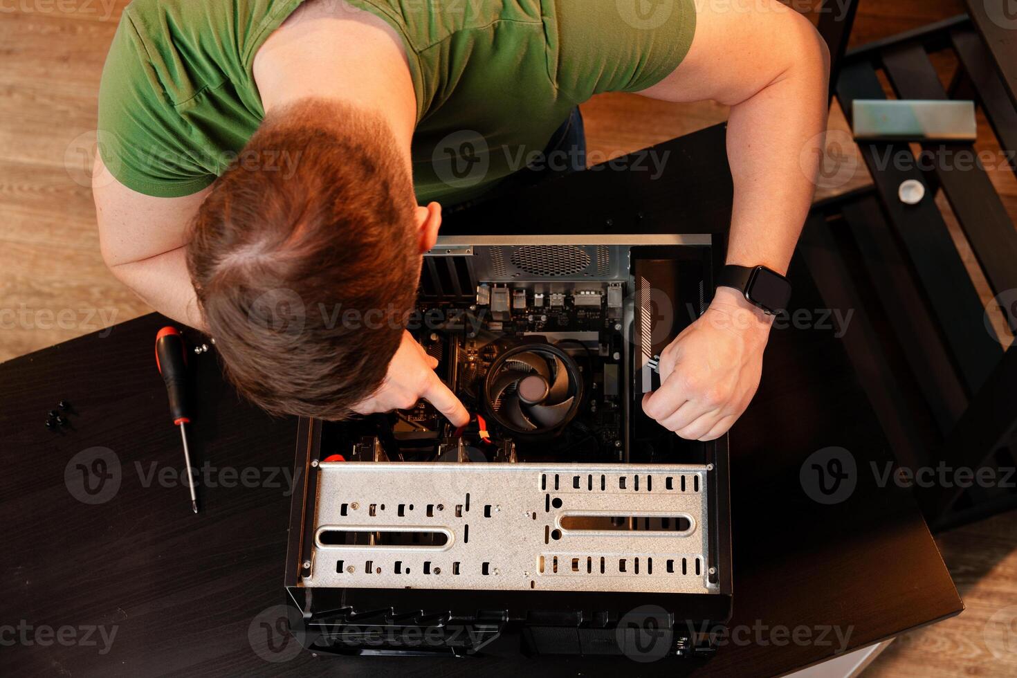 Close up of man repairing computer system unit photo