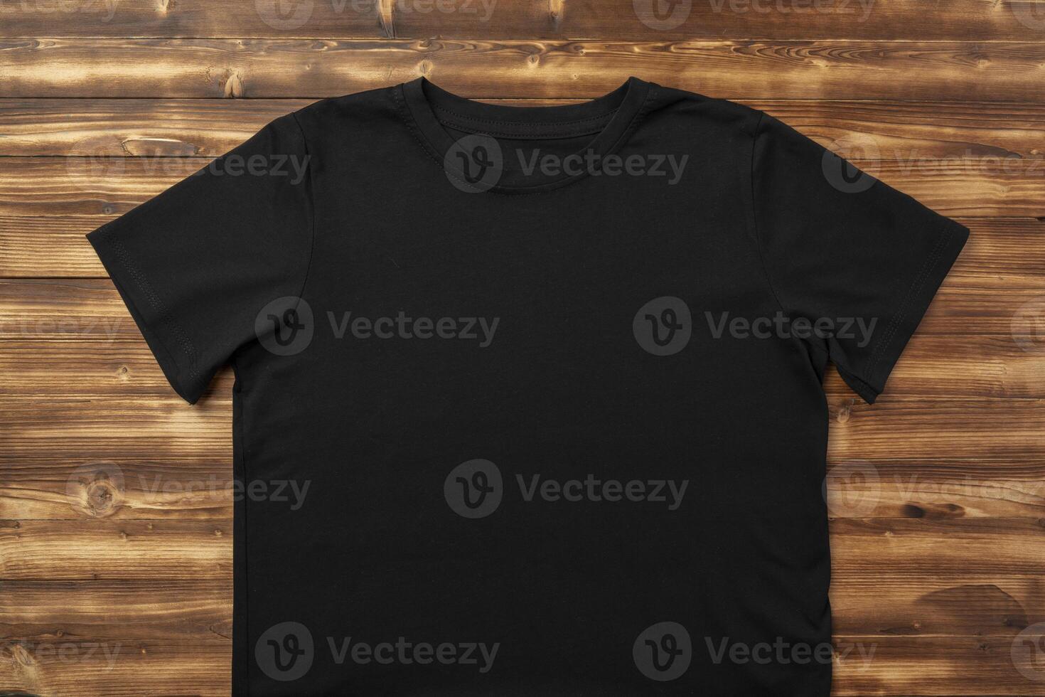 Cotton T-shirt mock up on wooden background flat lay photo