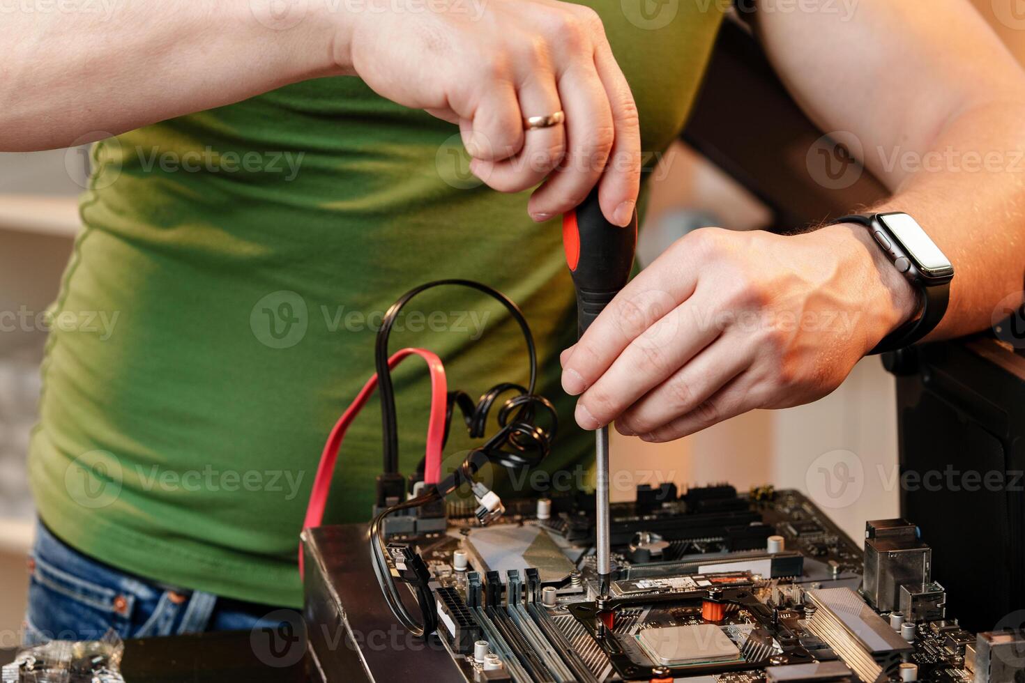 Close up of man repairing computer system unit photo