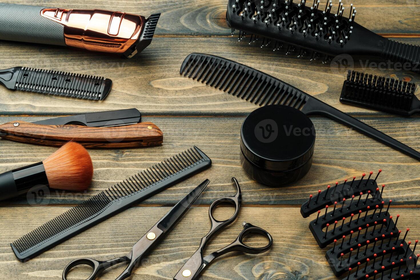Set of professional barber tools on wooden table photo