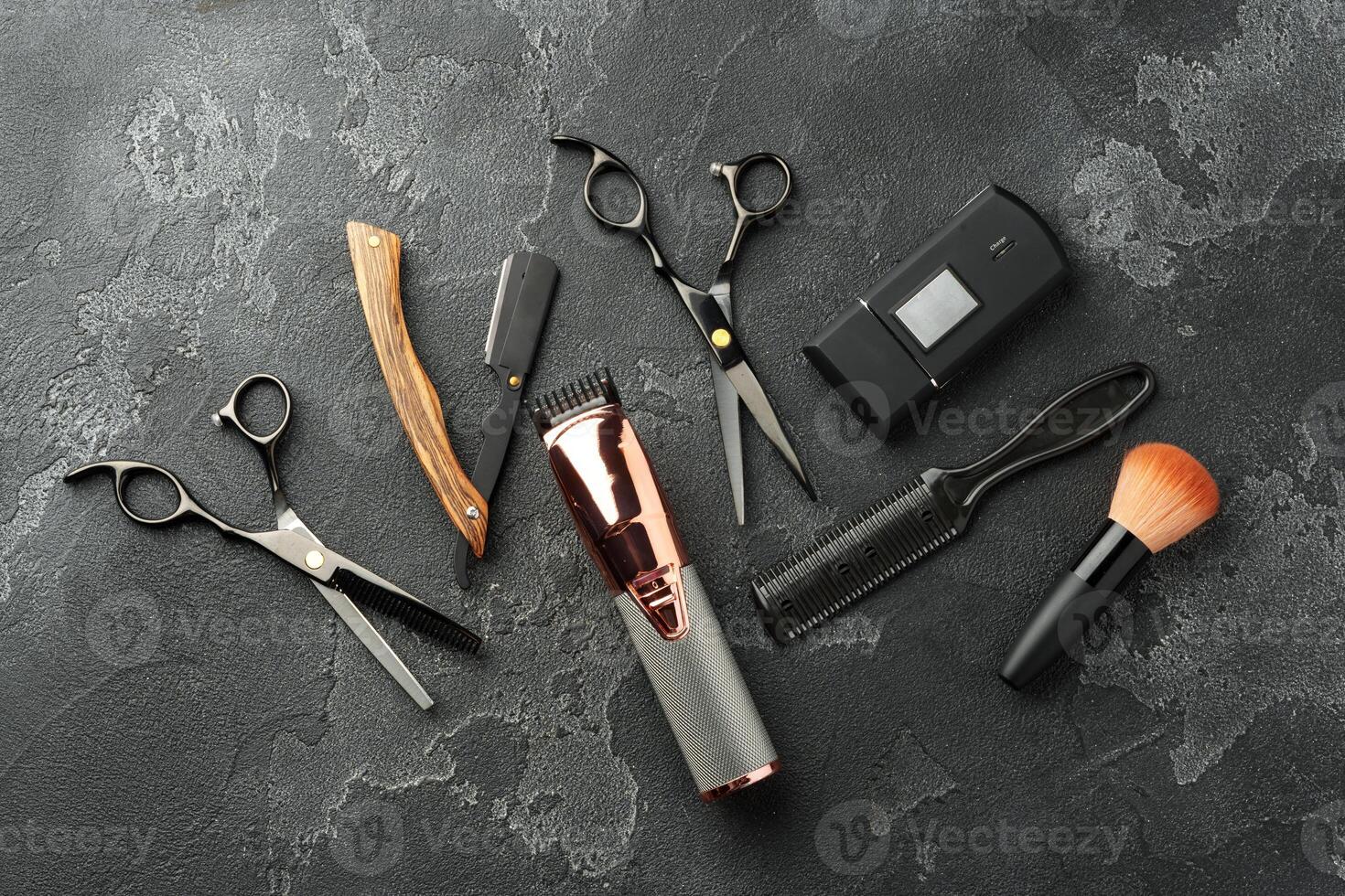Set of tools for hairdressing and barbershop on gray background photo