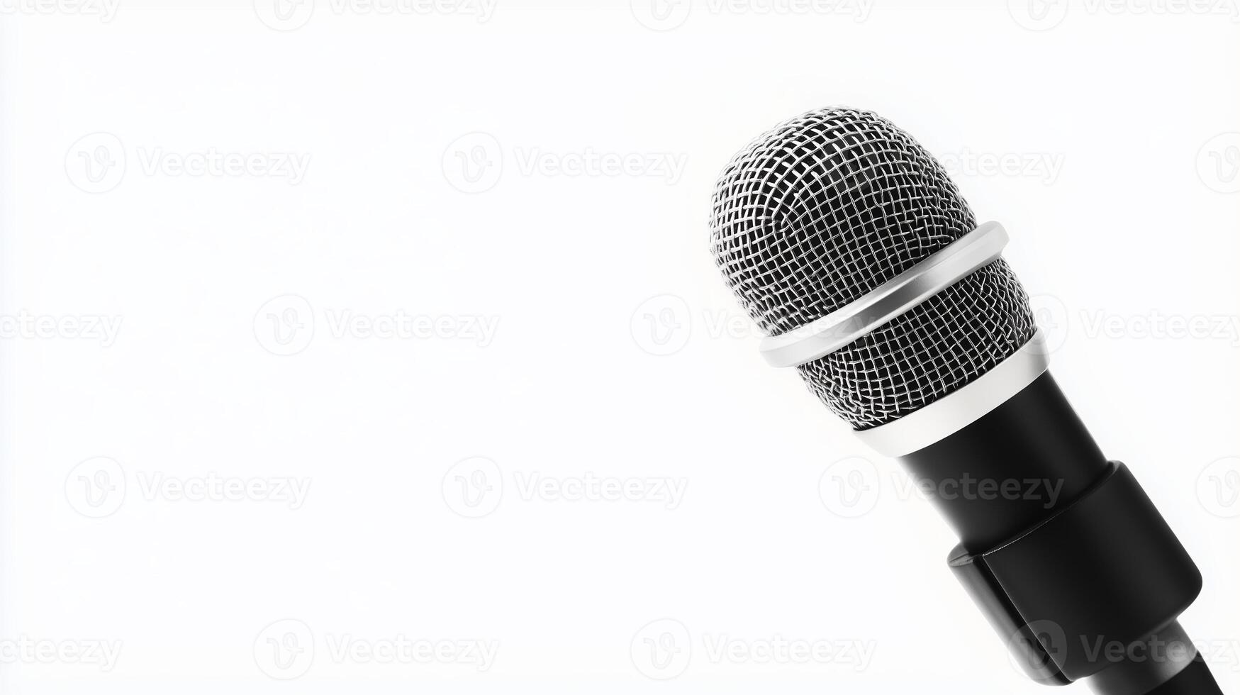 Microphone positioned on a simple backdrop ready for recording or performance in a studio setting photo