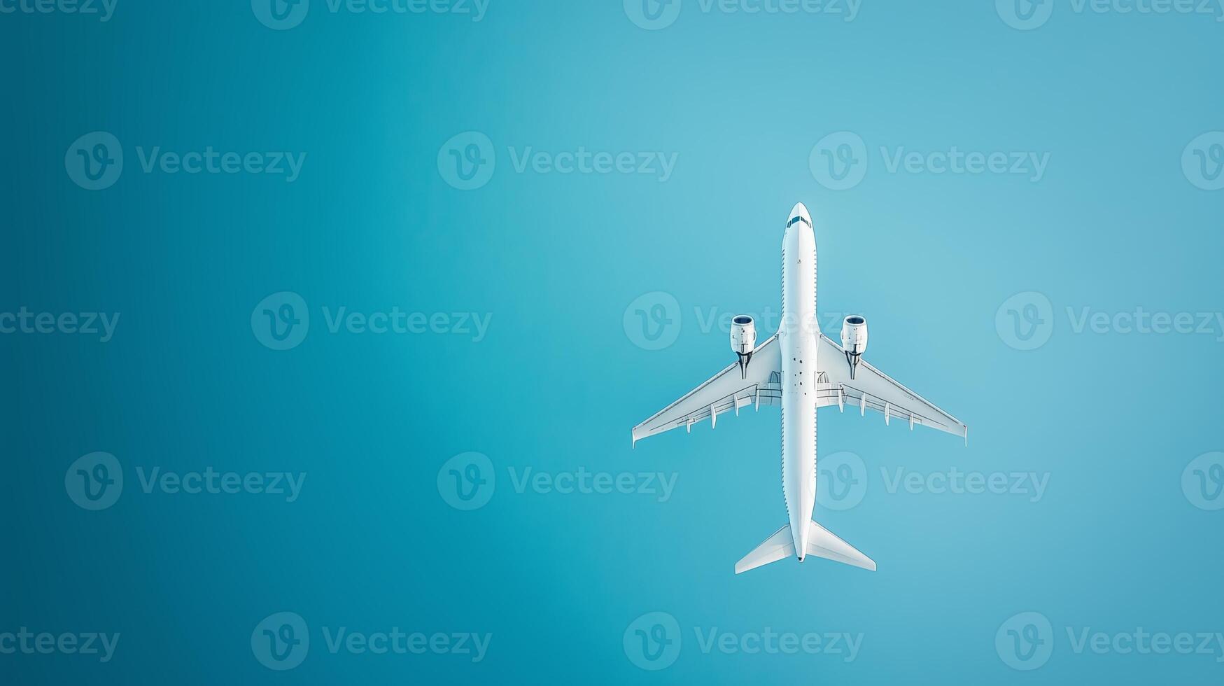 A commercial airplane flying high in a clear blue sky during daytime showing its underside and wings extended photo