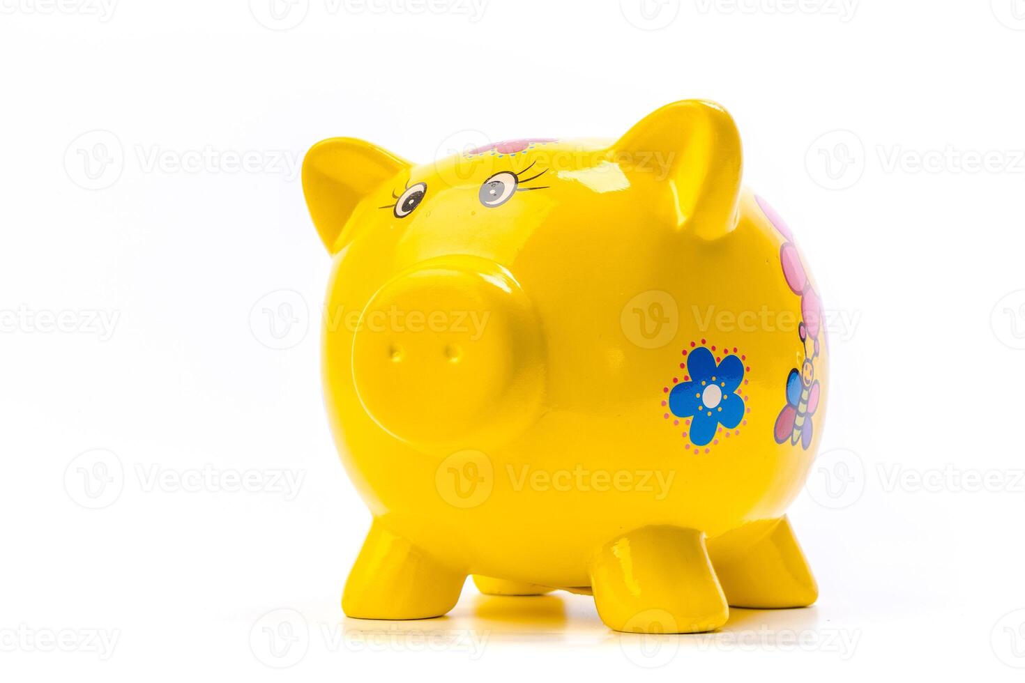 yellow piggy bank isolated on white photo