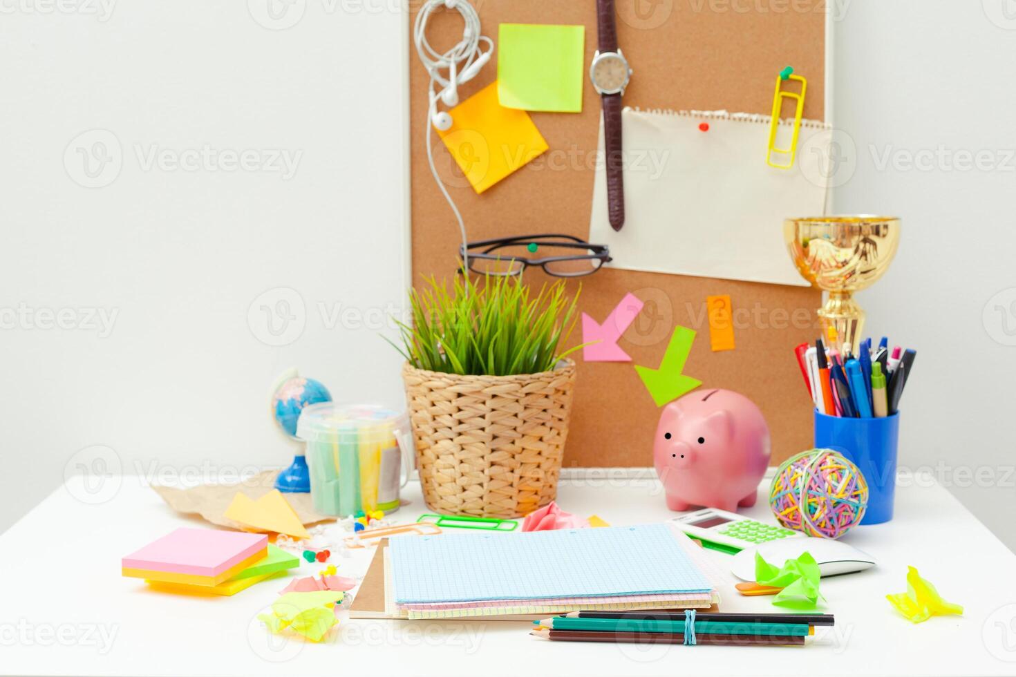Work place of a creative person with a variety of colorful stationery objects photo
