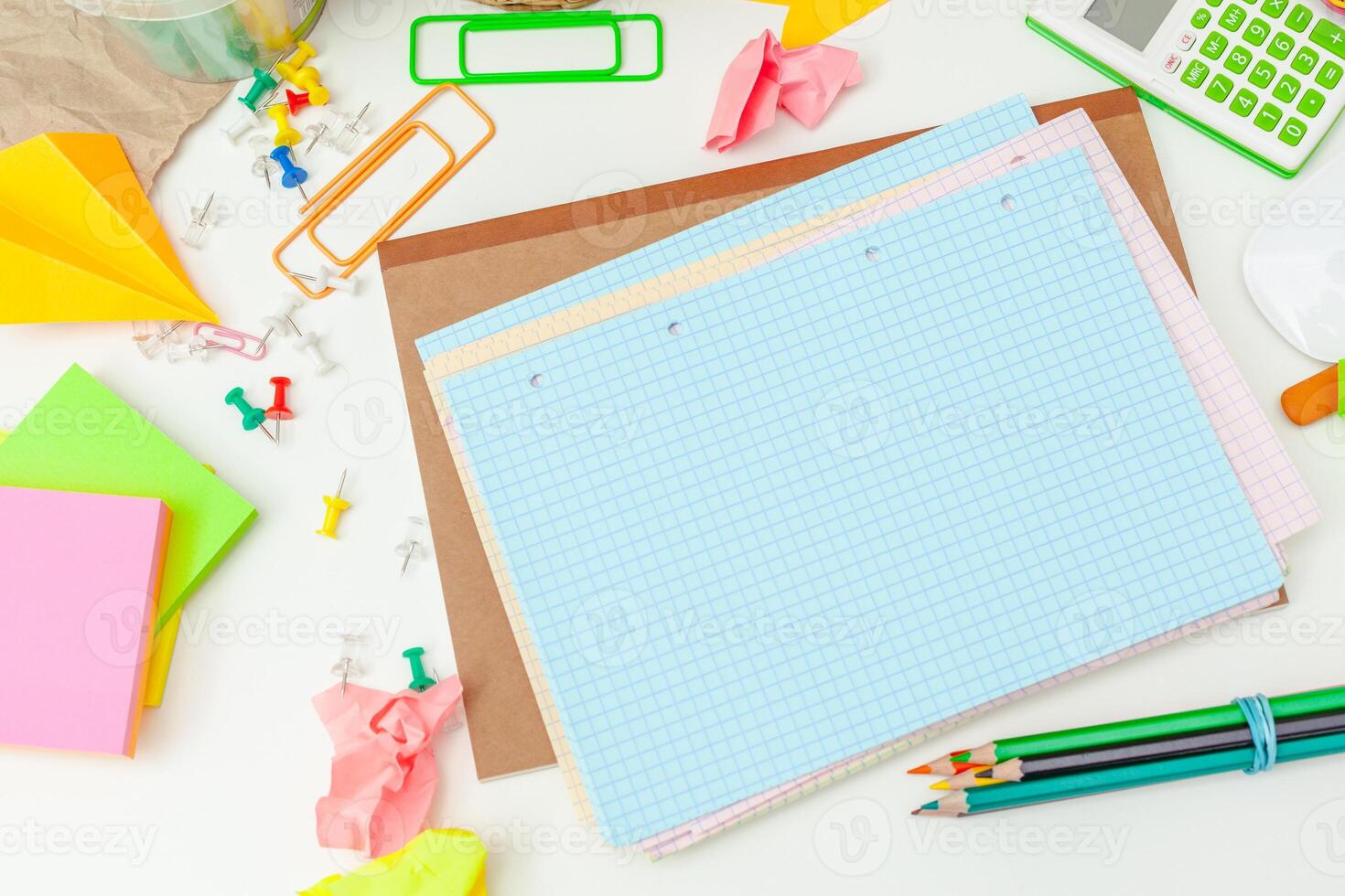 Work place of a creative person with a variety of colorful stationery objects photo