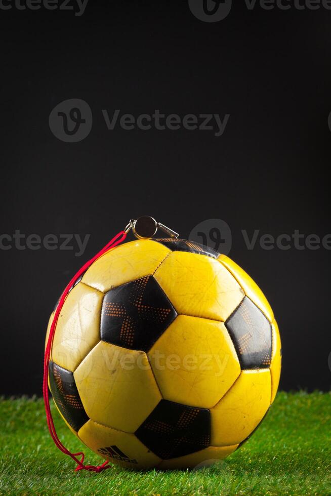 soccer ball on the green field photo