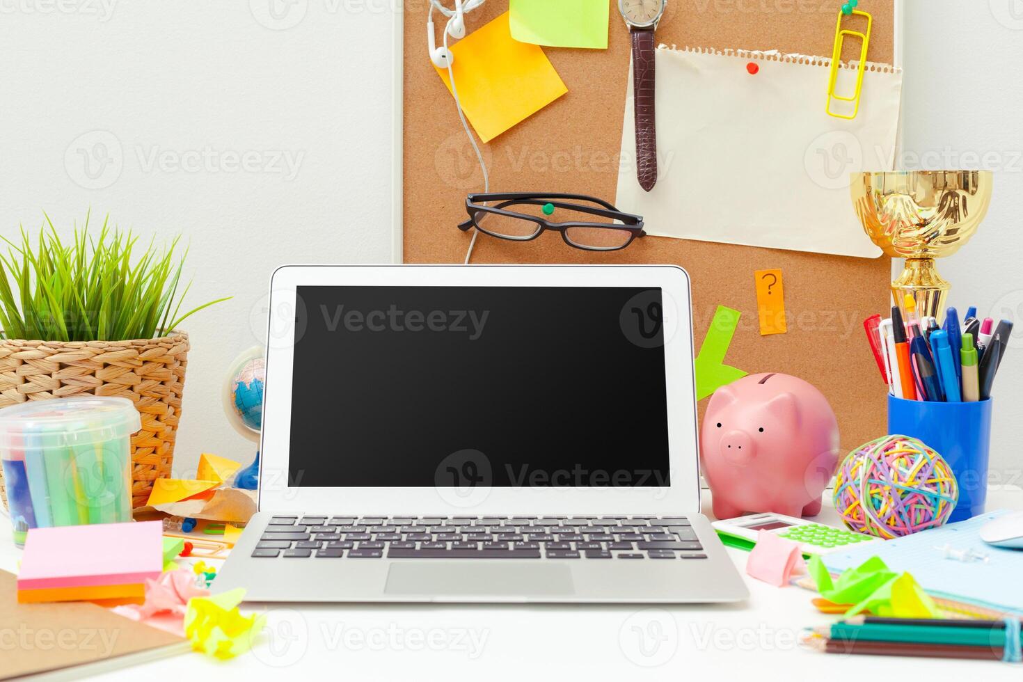 Work place of a creative person with a variety of colorful stationery objects photo