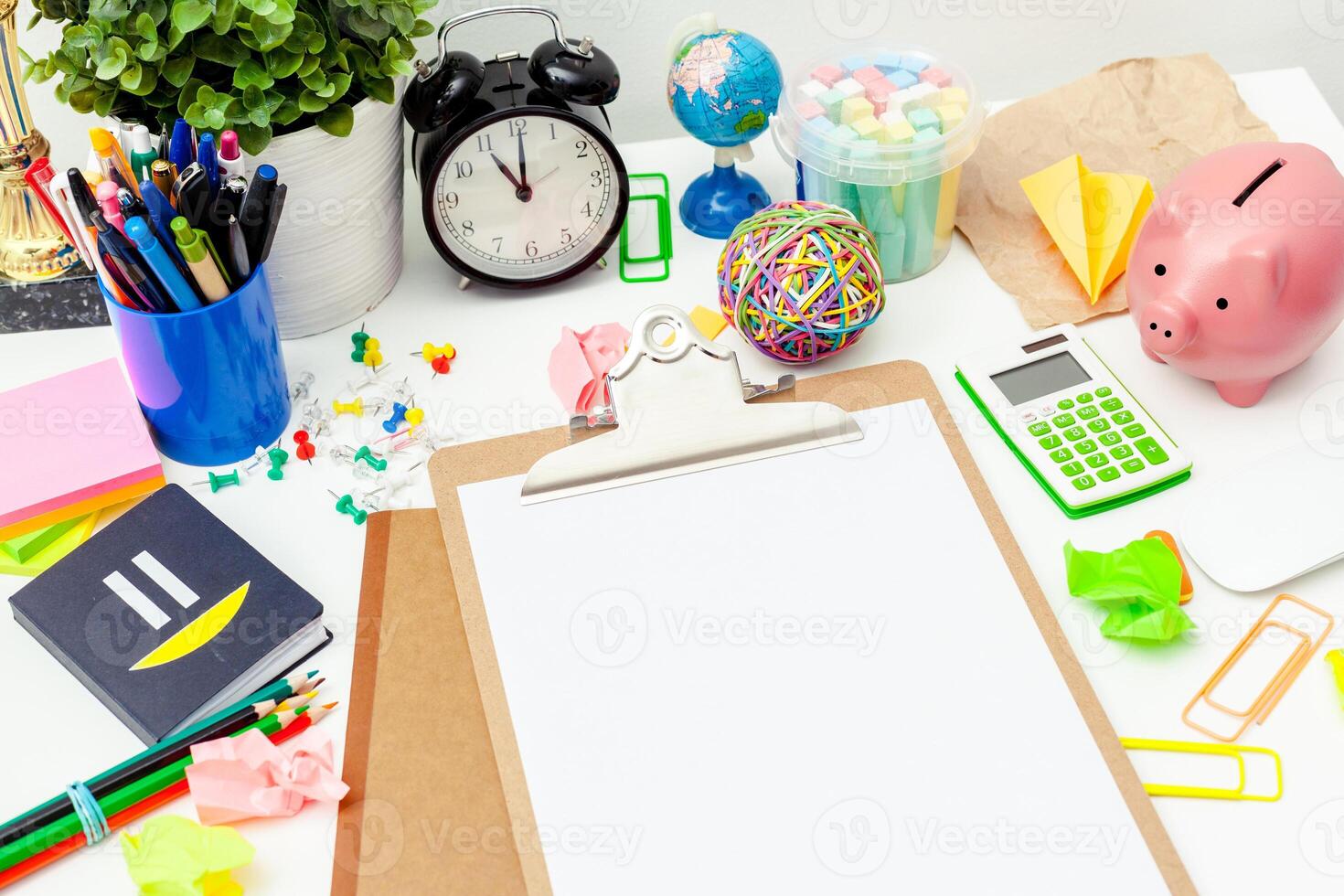 Work place of a creative person with a variety of colorful stationery objects photo