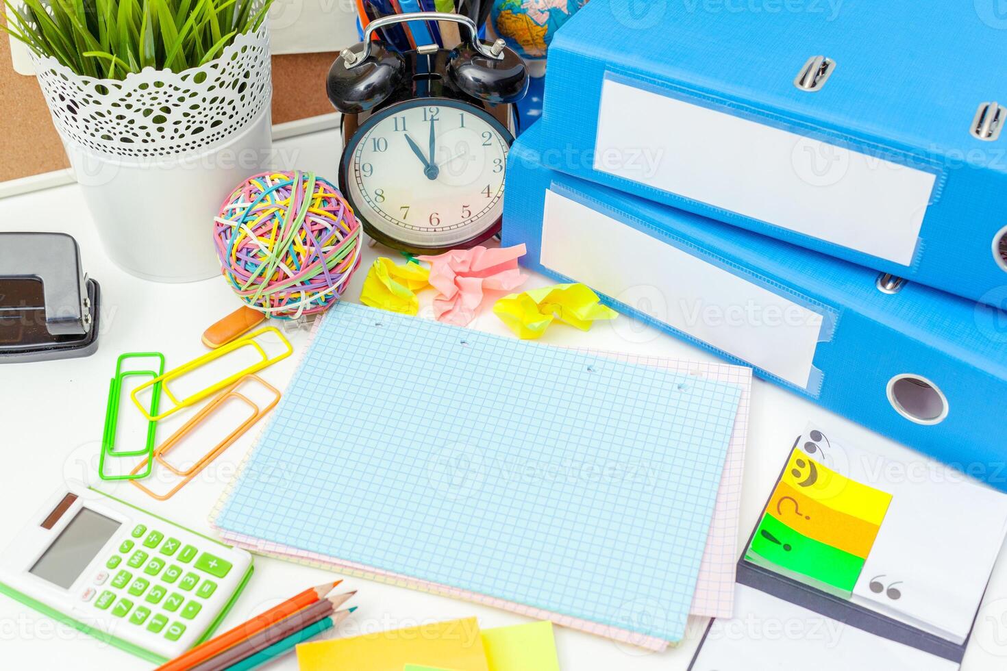 Work place of a creative person with a variety of colorful stationery objects photo
