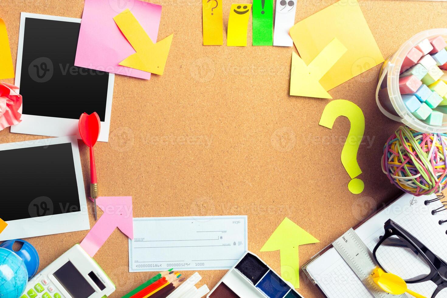 Desk of an artist with lots of stationery objects photo