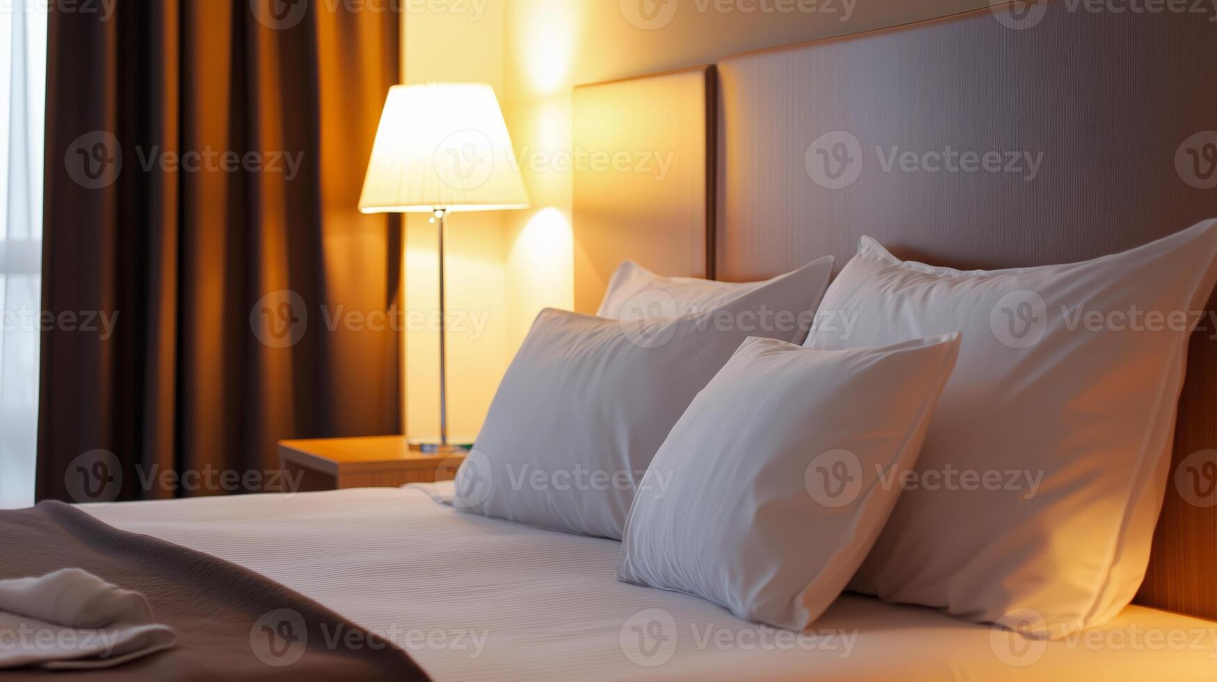 Cozy and inviting hotel room with soft lighting and comfortable bed ready for relaxation in the evening photo