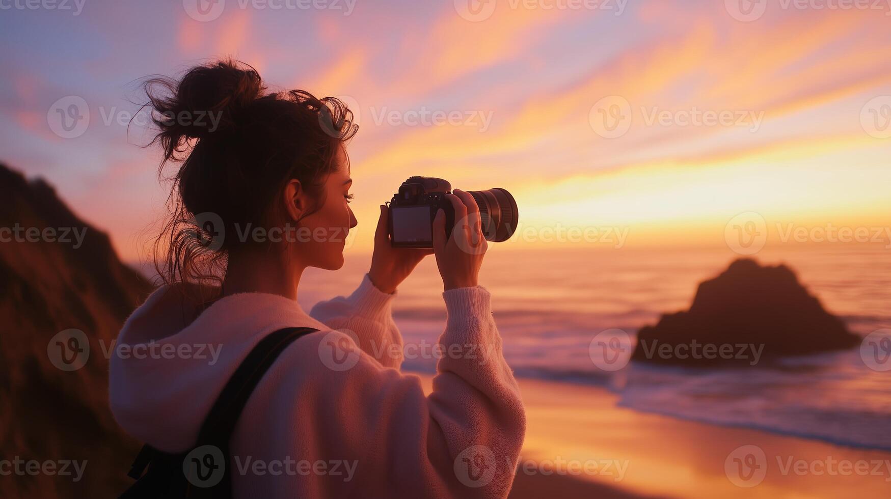 Sunset photographer captures breathtaking coastal views at a scenic beach location with colorful skies during the golden hour photo