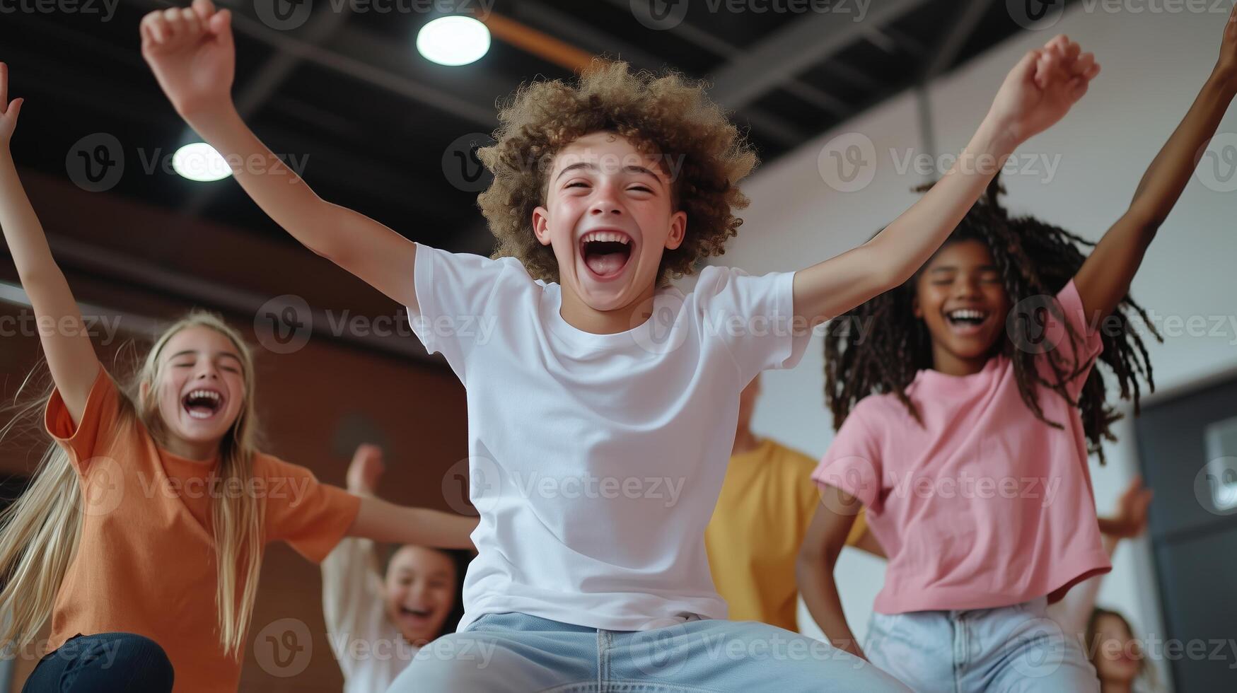 Joyful group of children celebrating together indoors during a fun activity session in a bright recreation center photo
