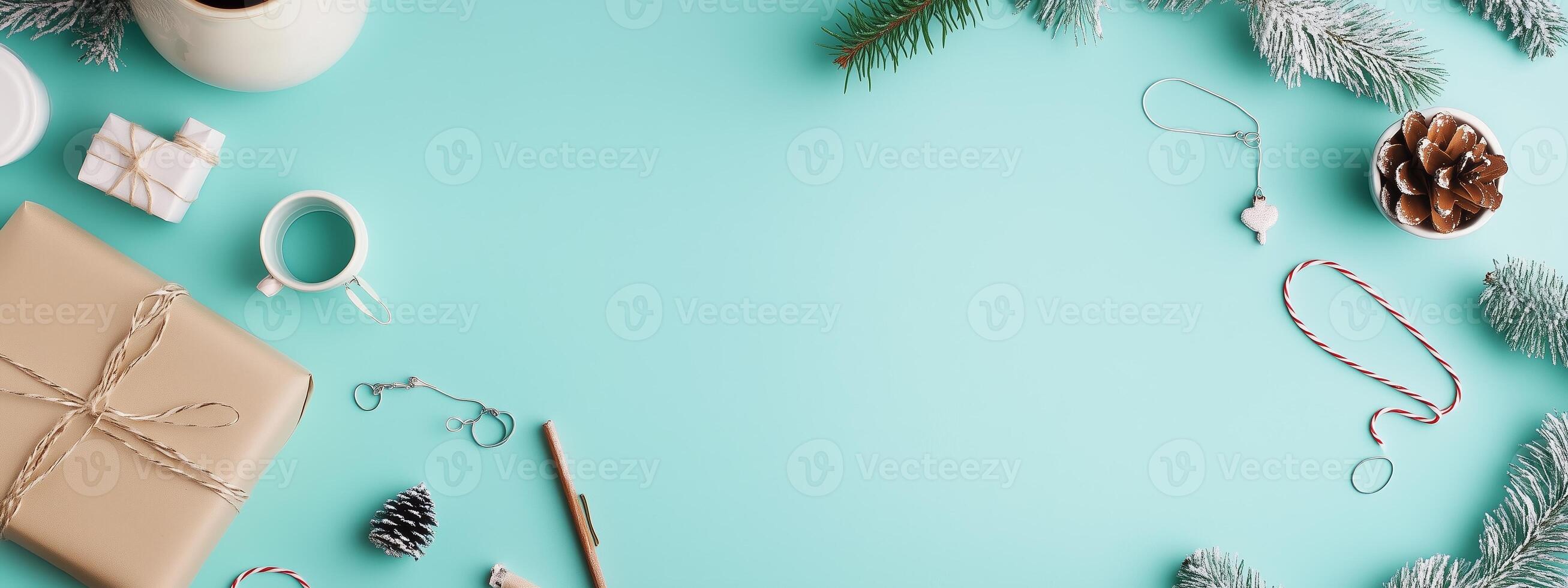 Winter-themed flat lay featuring gifts, decorative pine, and a cozy cup of coffee on a turquoise background photo