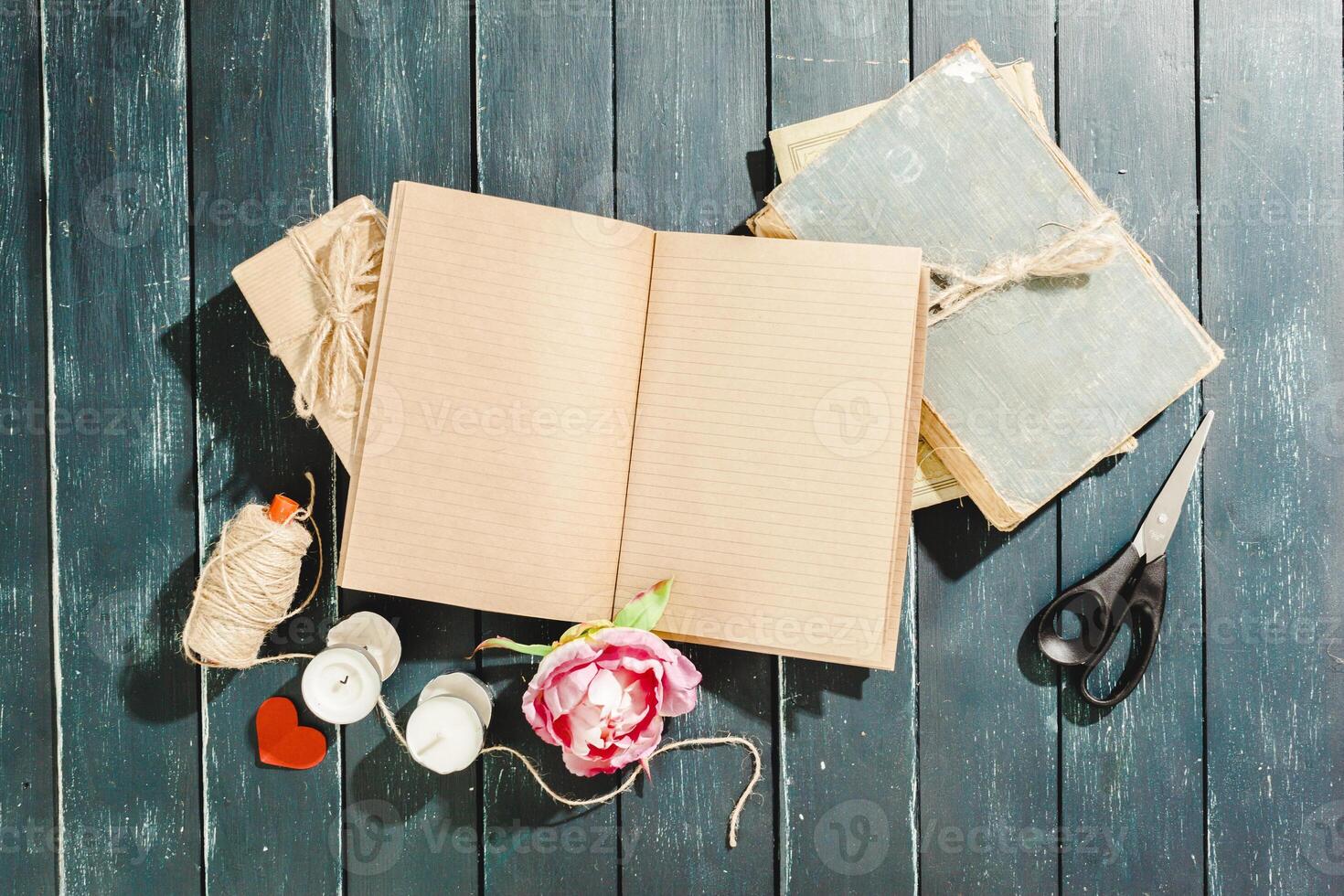 flowers with empty vintage notebook for your design photo