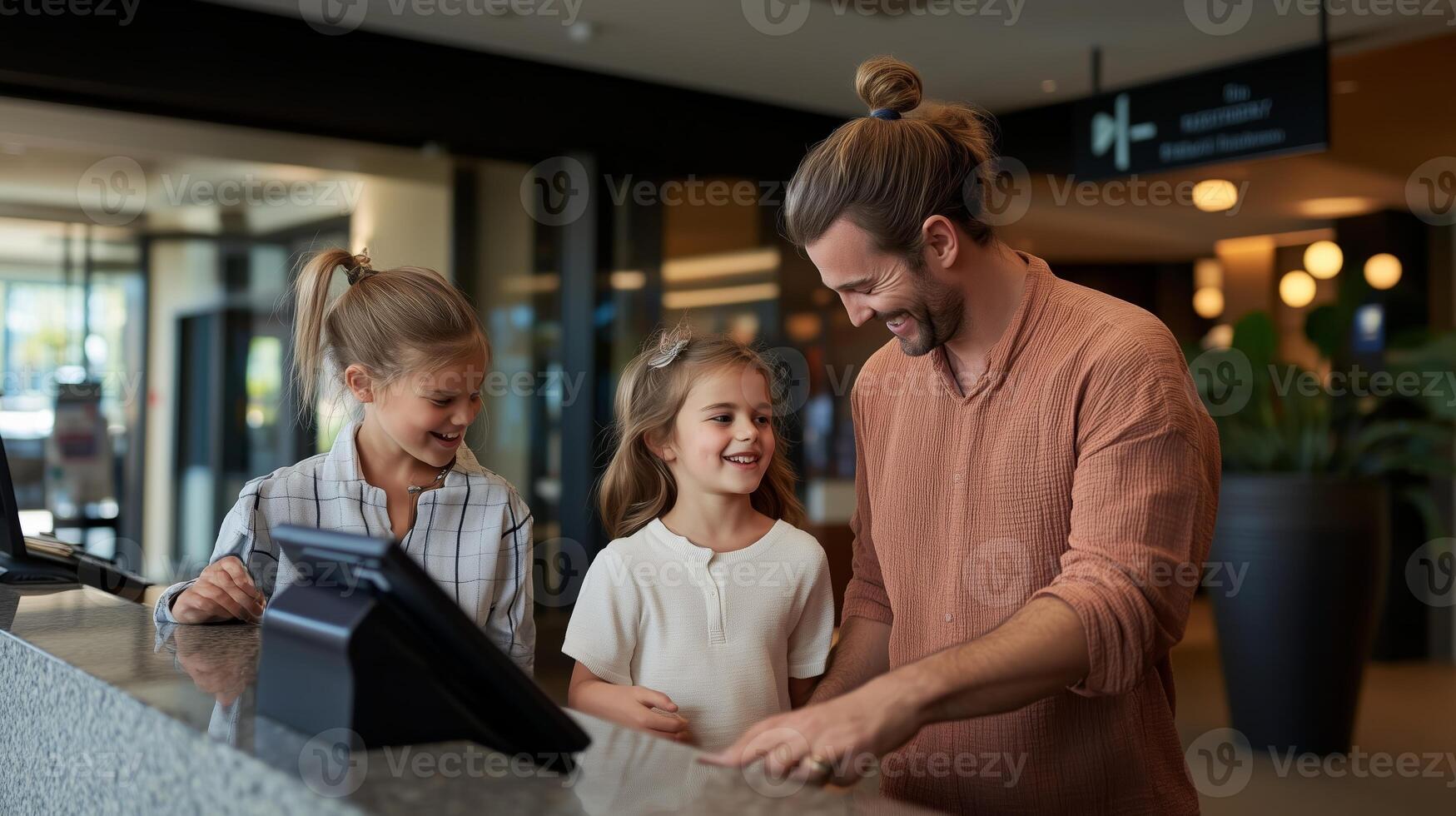 Family enjoying a joyful moment together at a hotel check-in desk during their vacation photo