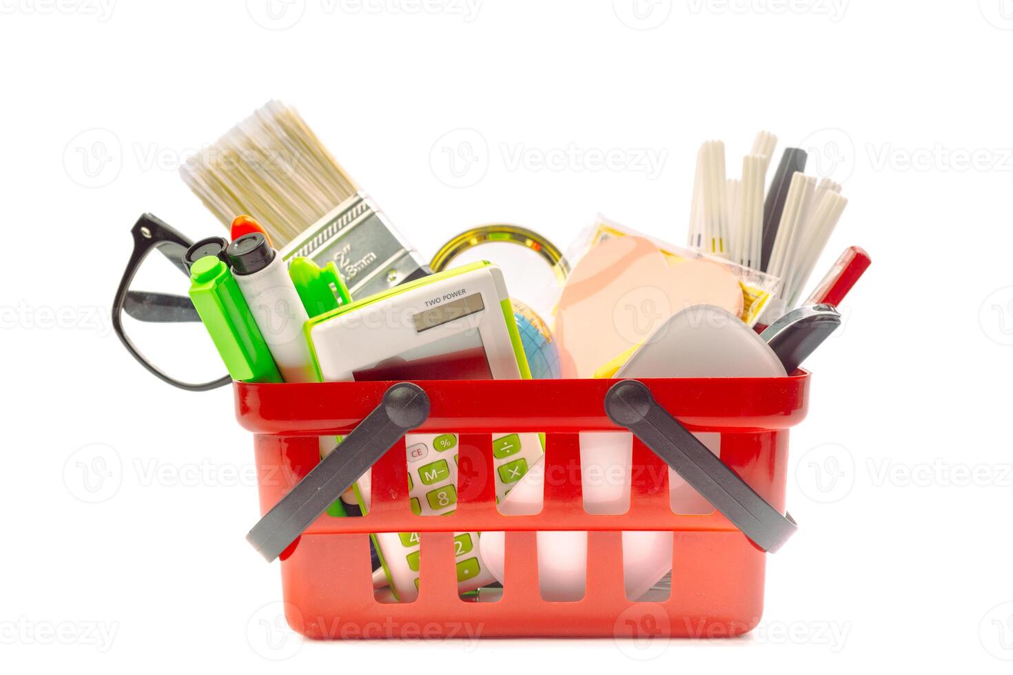 Multiple office tools in a shopping cart, isolated on white background photo