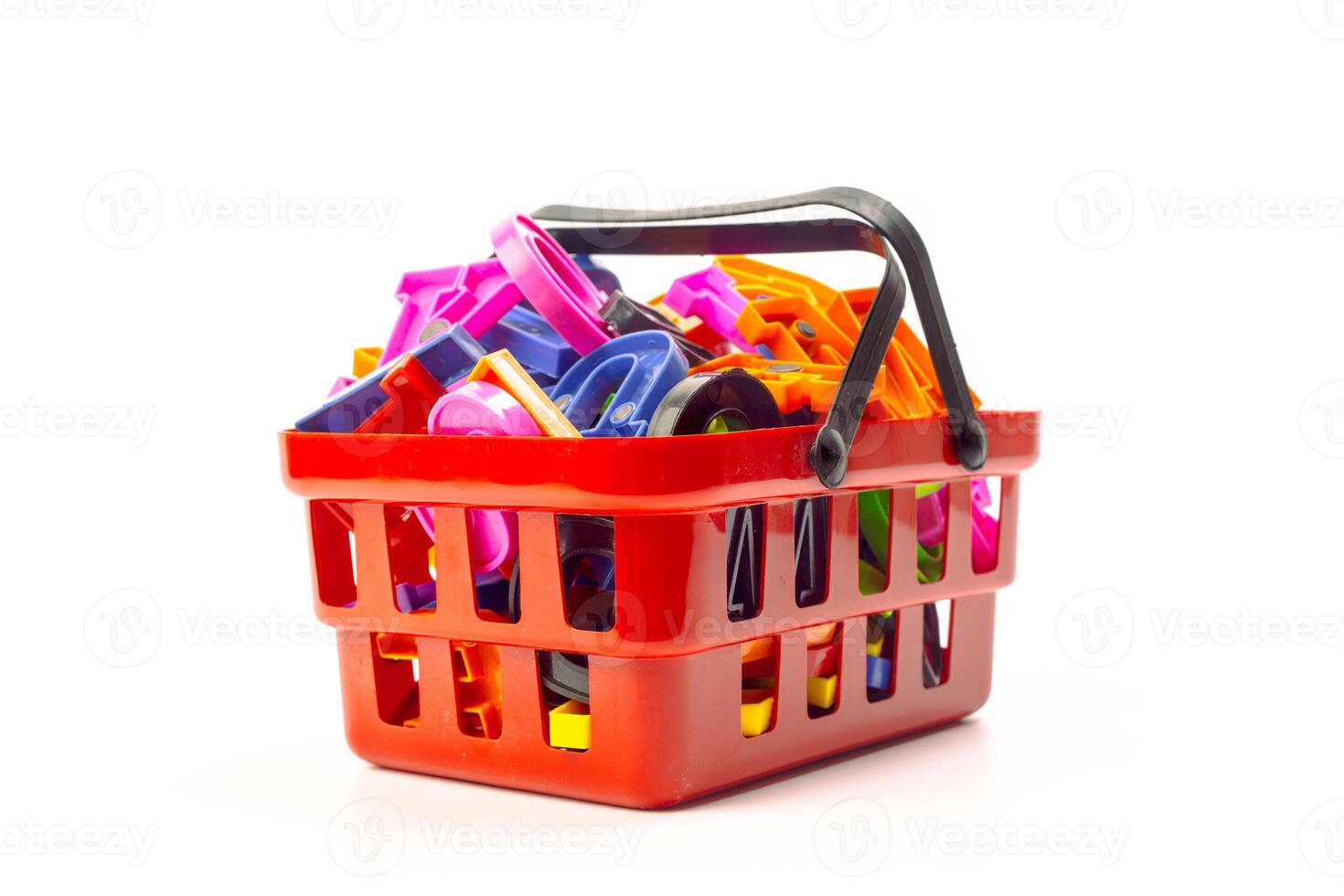 Multiple office tools in a shopping cart, isolated on white background photo