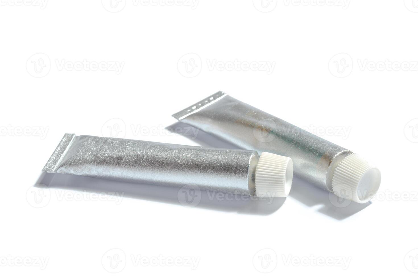 paint in tubes isolated on white photo