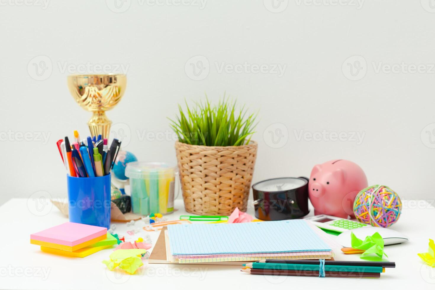 Work place of a creative person with a variety of colorful stationery objects photo