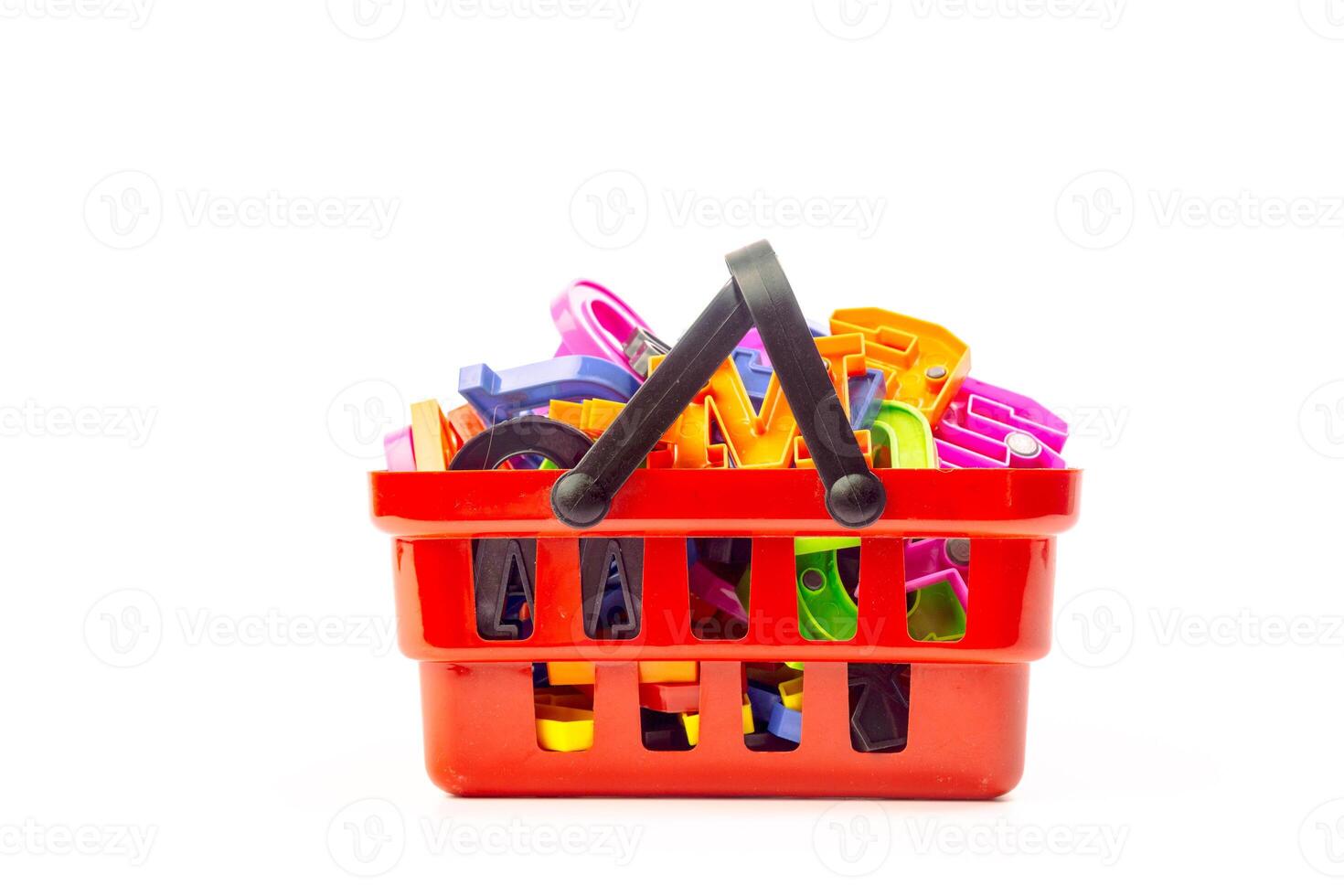 Multiple office tools in a shopping cart, isolated on white background photo