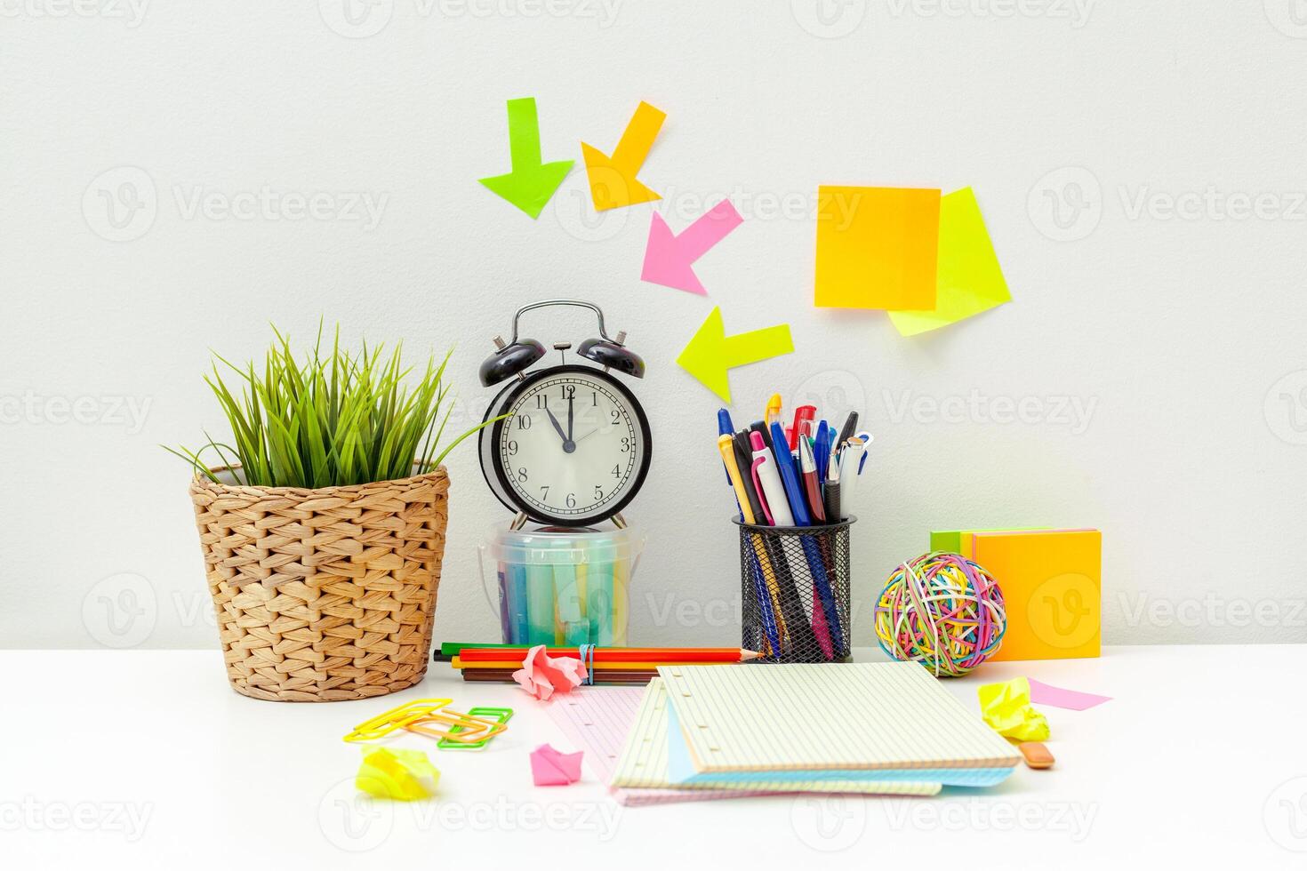 Work place of a creative person with a variety of colorful stationery objects photo