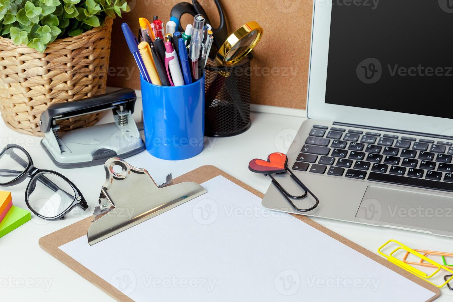 Work place of a creative person with a variety of colorful stationery objects photo