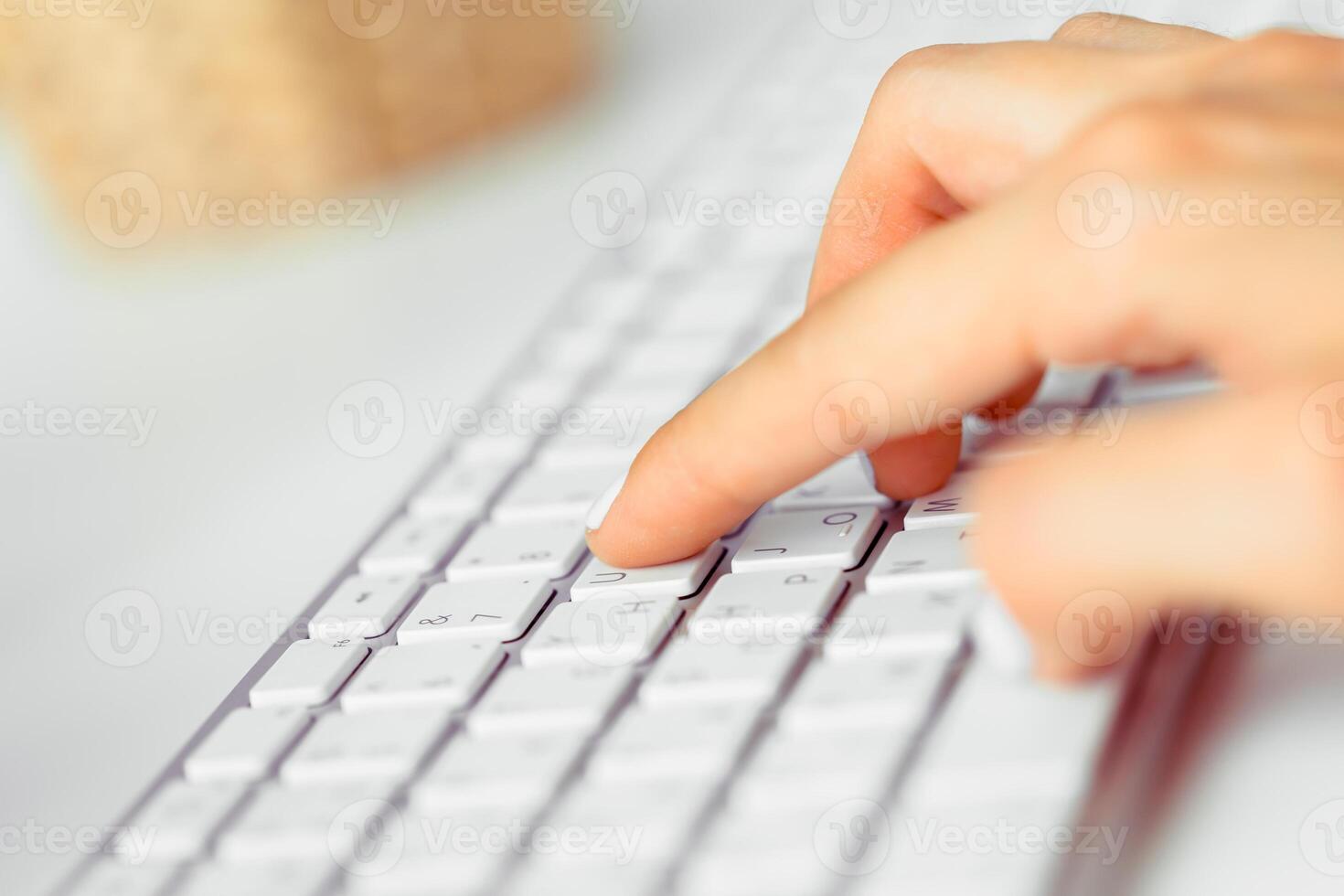 Hands of an office woman typing photo