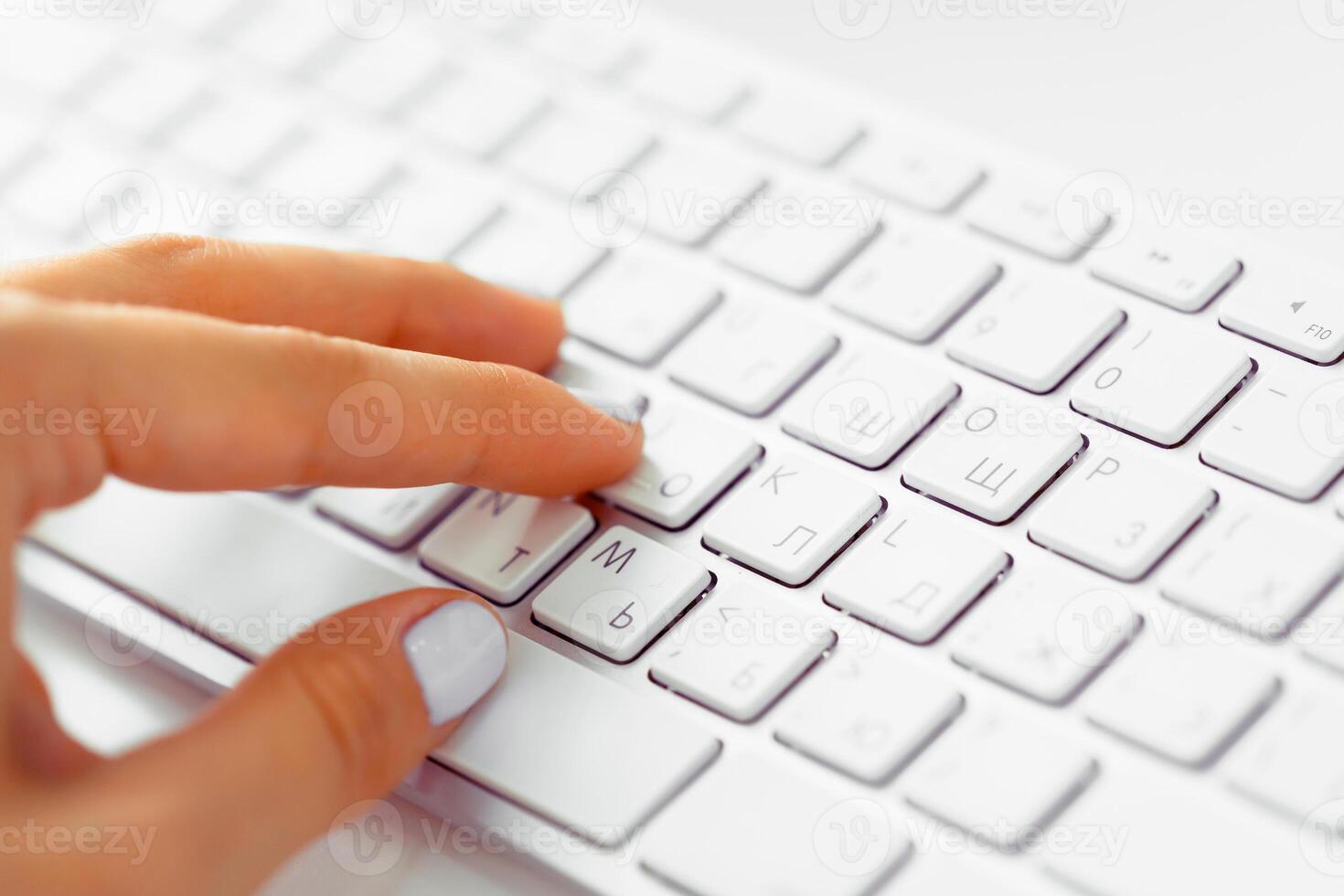 Hands of an office woman typing photo