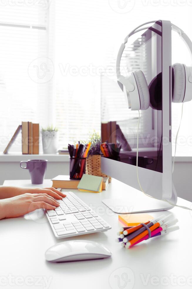 Hands of an office woman typing photo