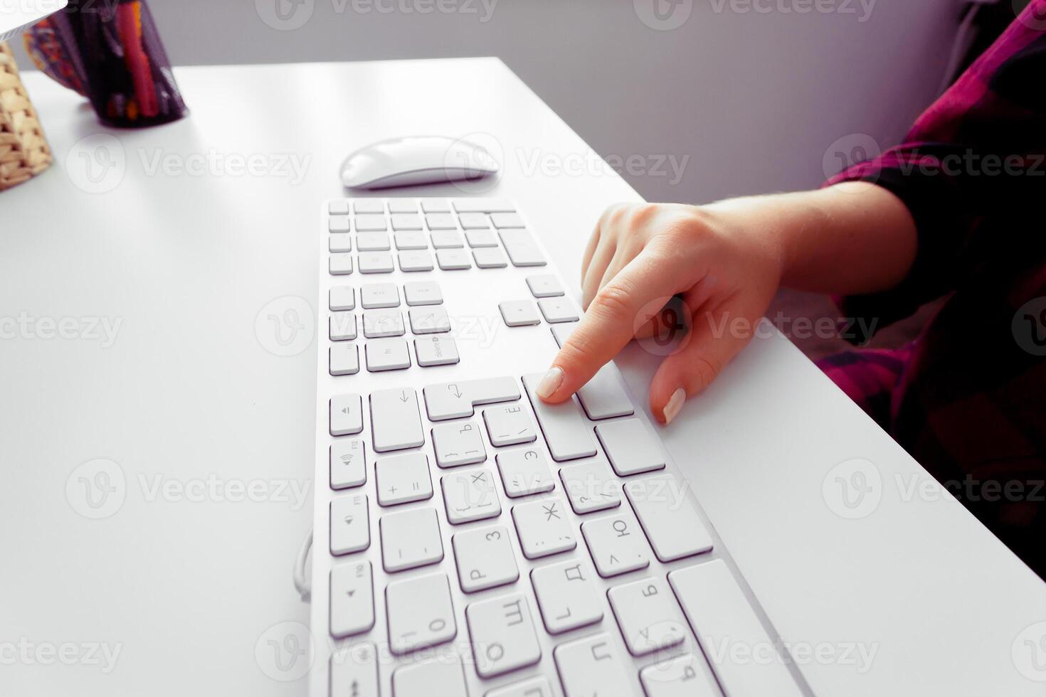 Hands of an office woman typing photo
