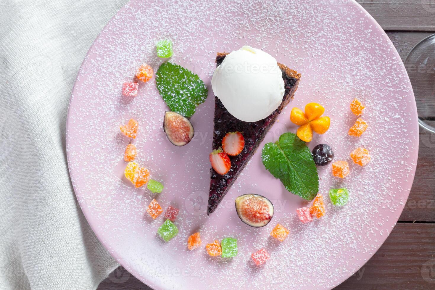a slice of pie with vanilla ice cream photo
