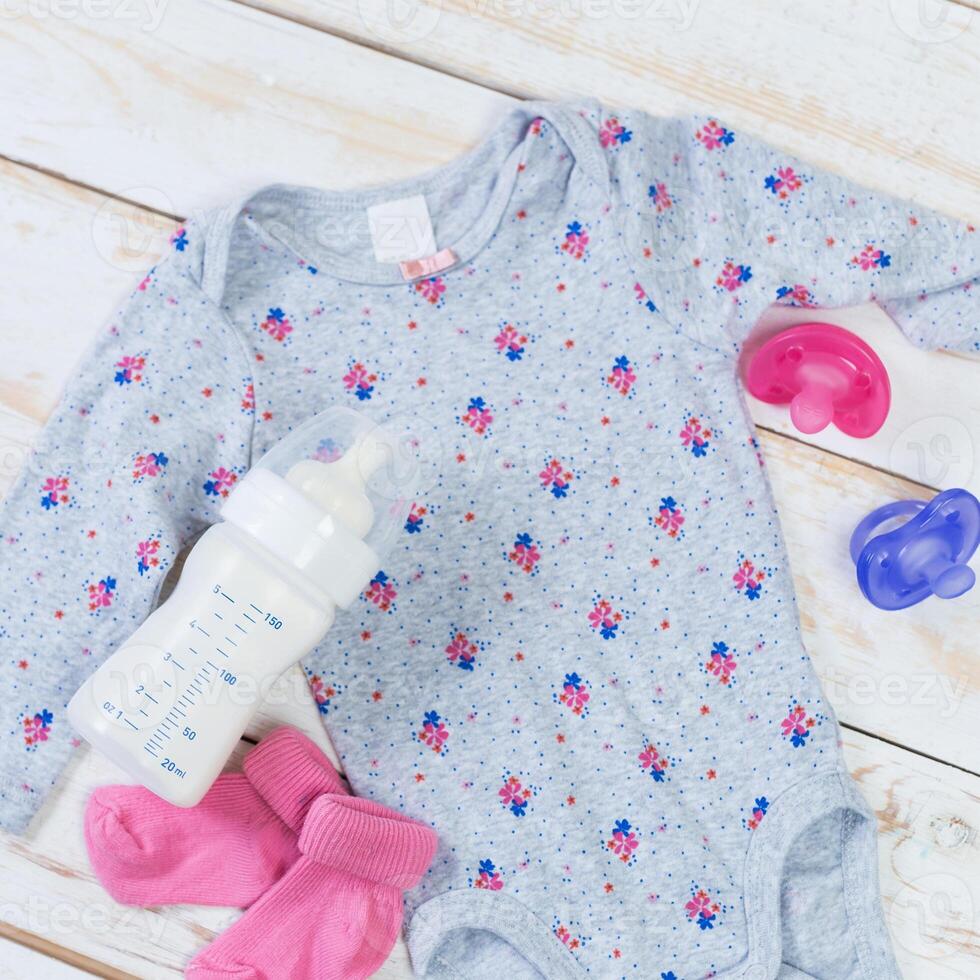 set of fashion trendy clothes and kids stuff for little baby girl photo