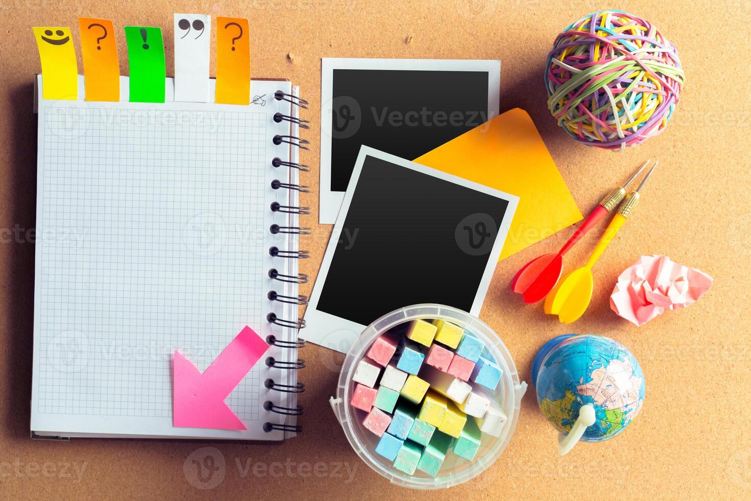 Desk of an artist with lots of stationery objects photo