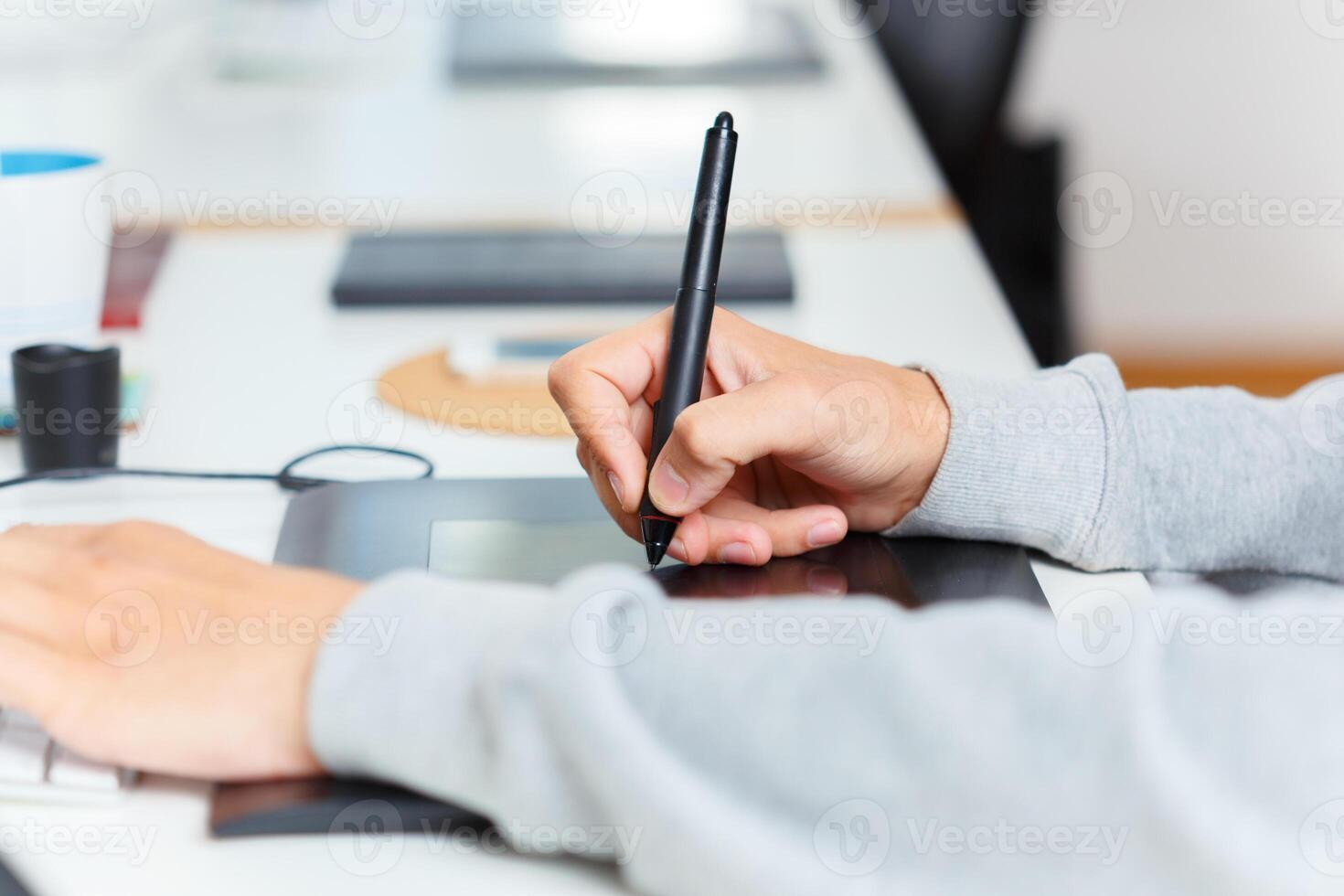 Designer using graphic tablet at office photo