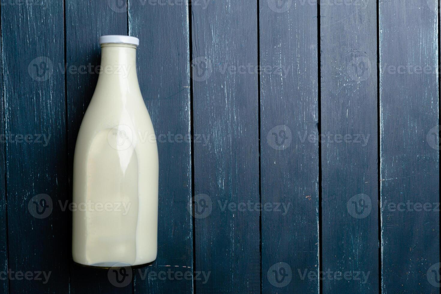 Natural whole milk in a bottle photo