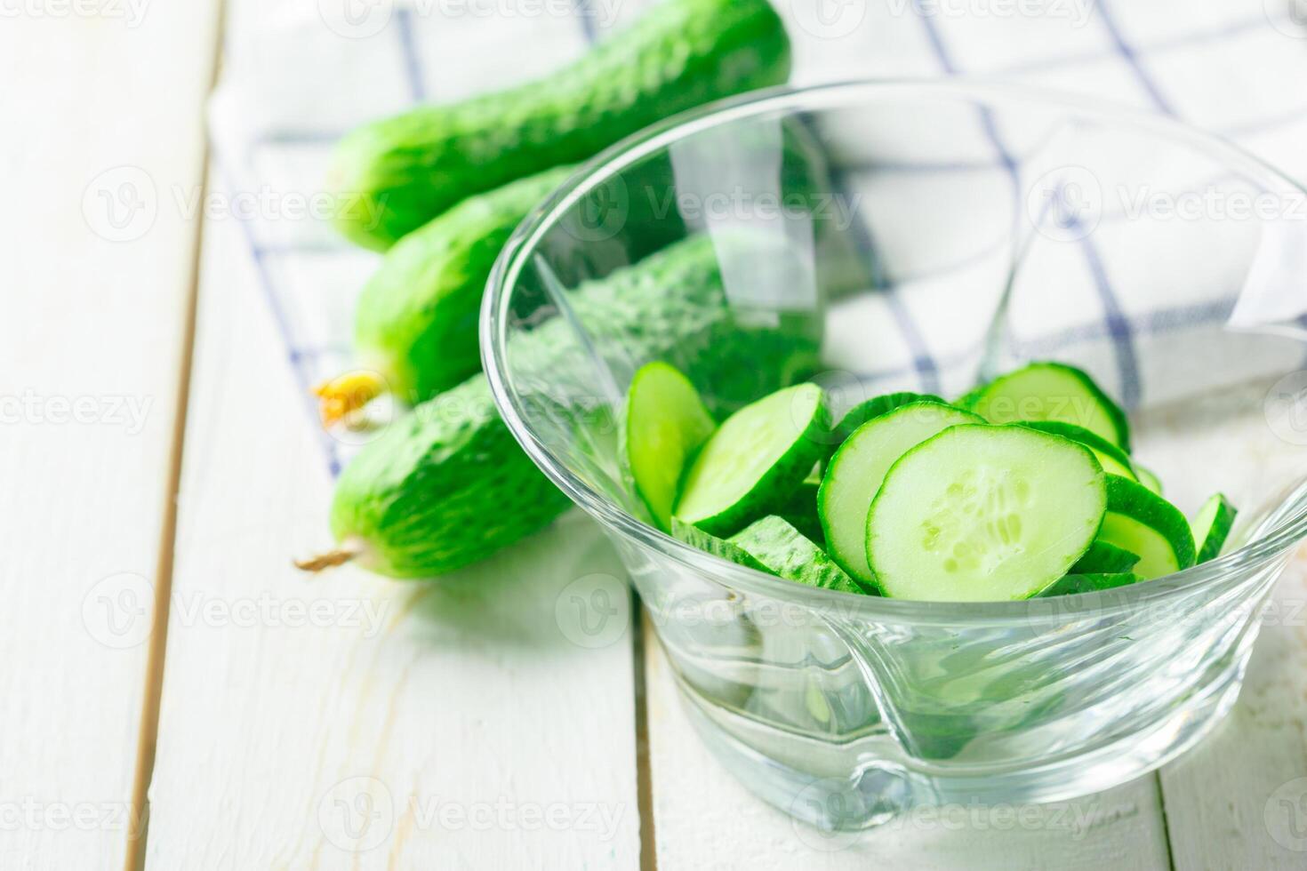 cucumbers on wooden background photo