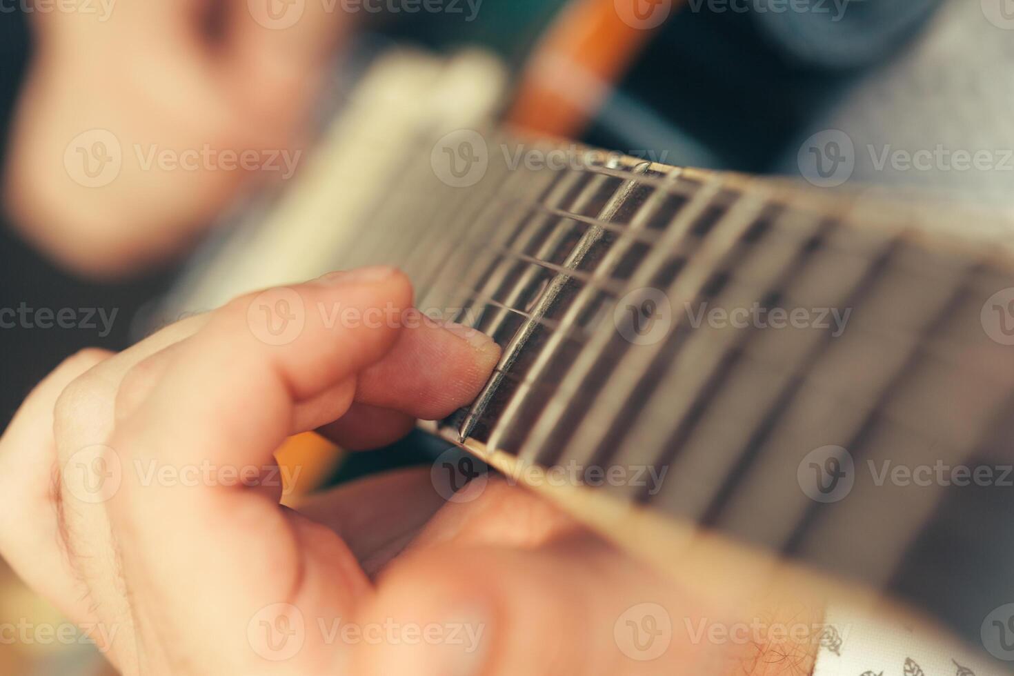 man playing electric guitar photo