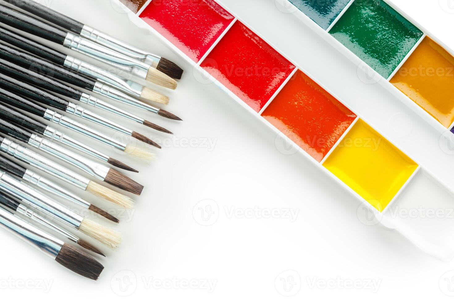 Set of watercolor paints and paintbrushes photo
