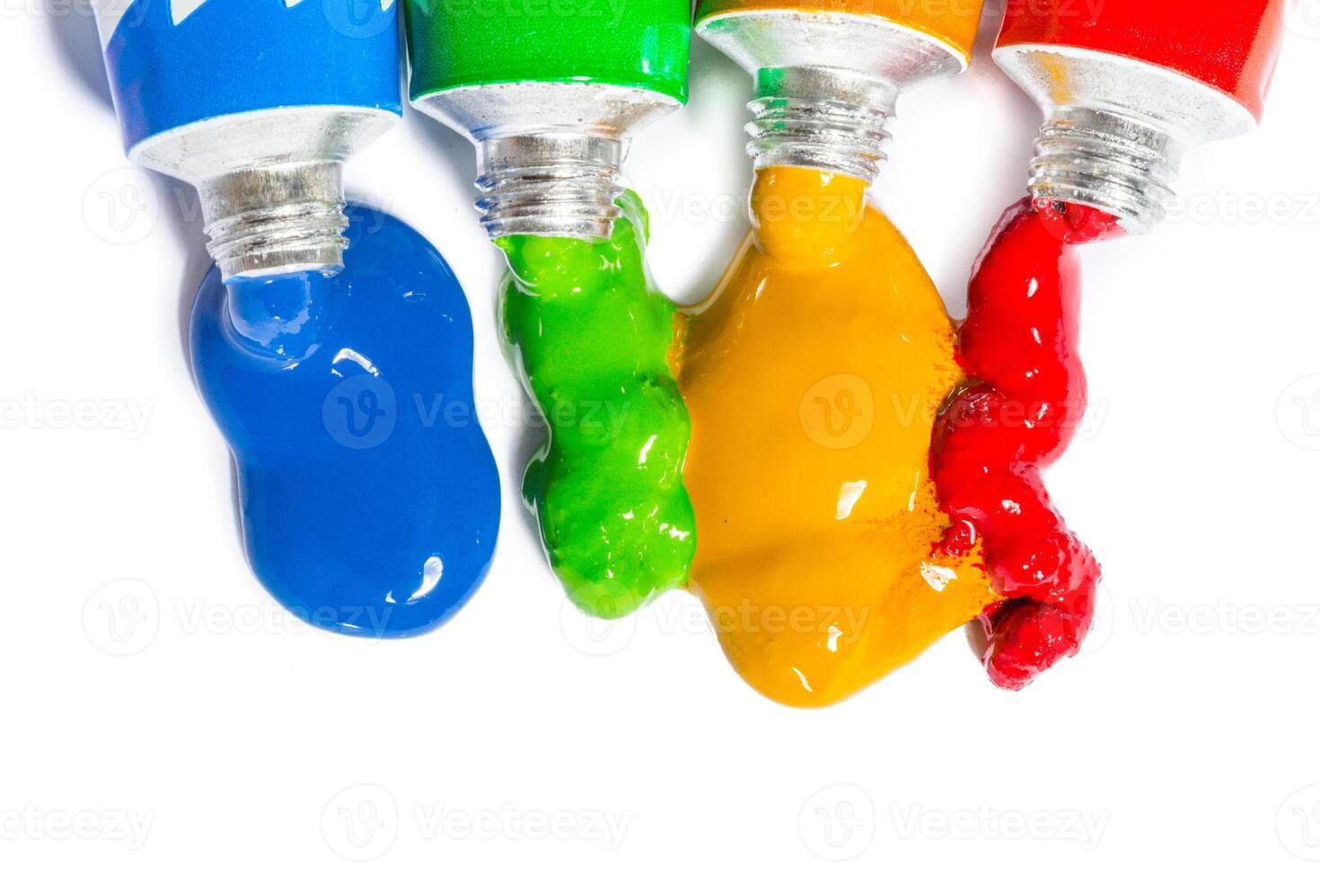 paint in tubes isolated on white photo