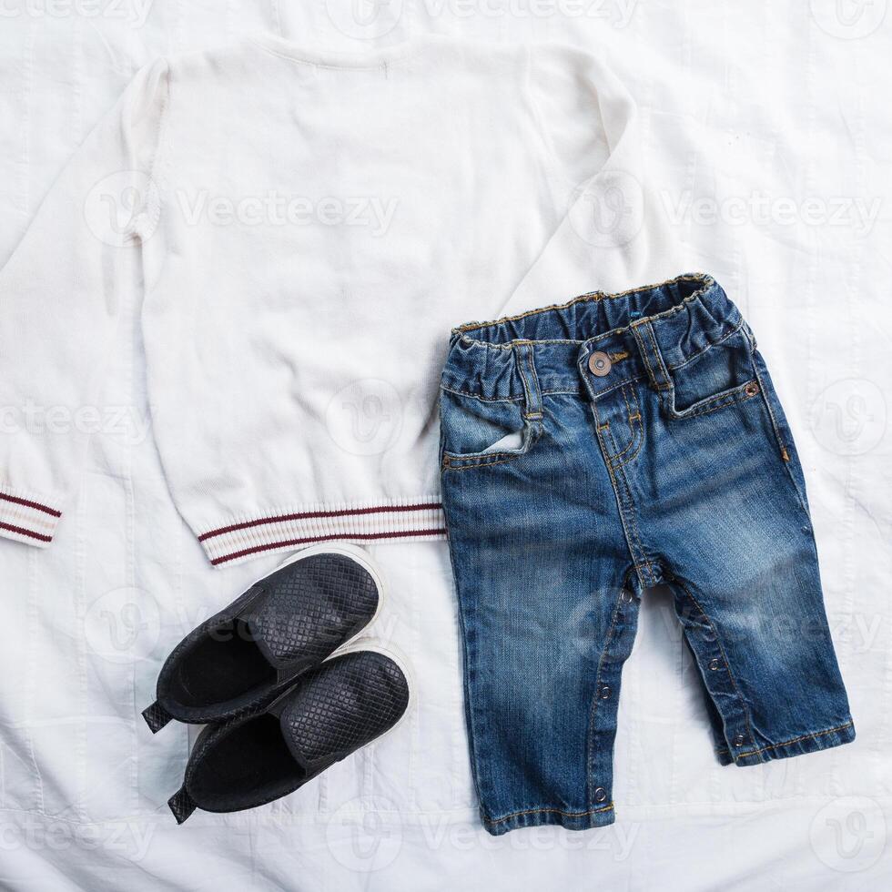 Baby boy clothes on white background photo