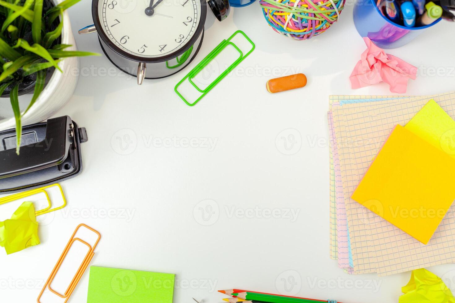 Work place of a creative person with a variety of colorful stationery objects photo