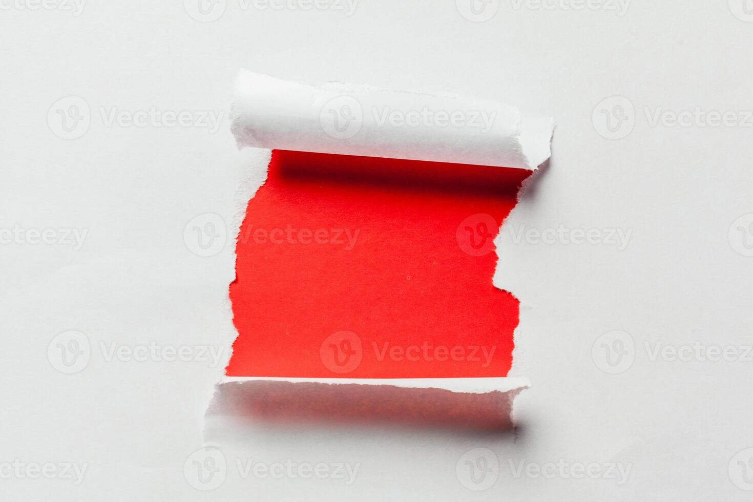 Hole in the paper with torn sides photo