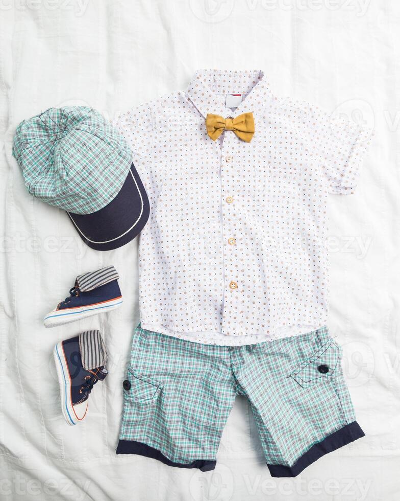 Baby boy clothes on white background photo