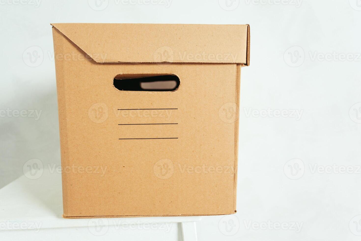 Big cardboard boxes standing insinde a room photo
