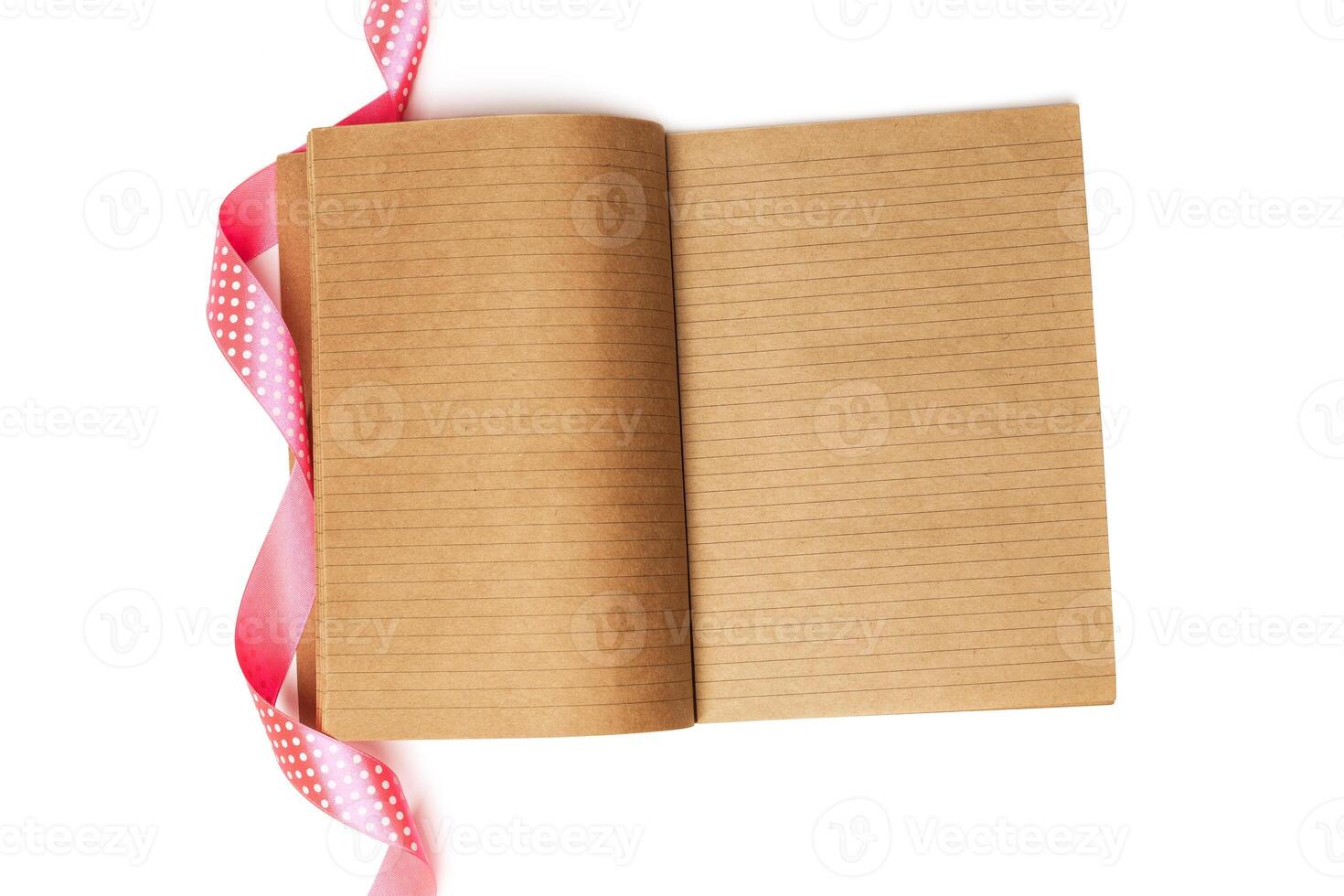Notebook and red ribbon photo