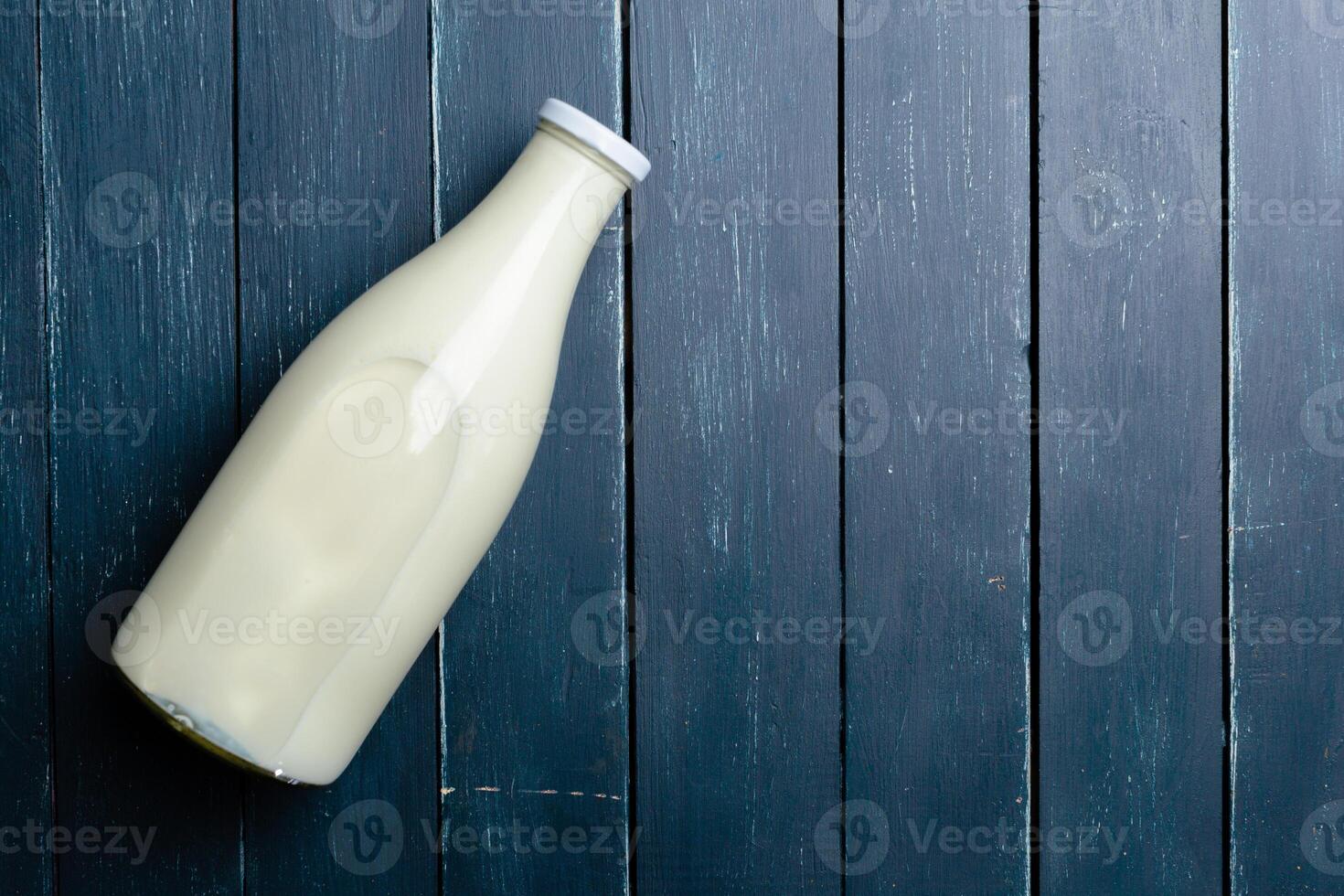 Natural whole milk in a bottle photo