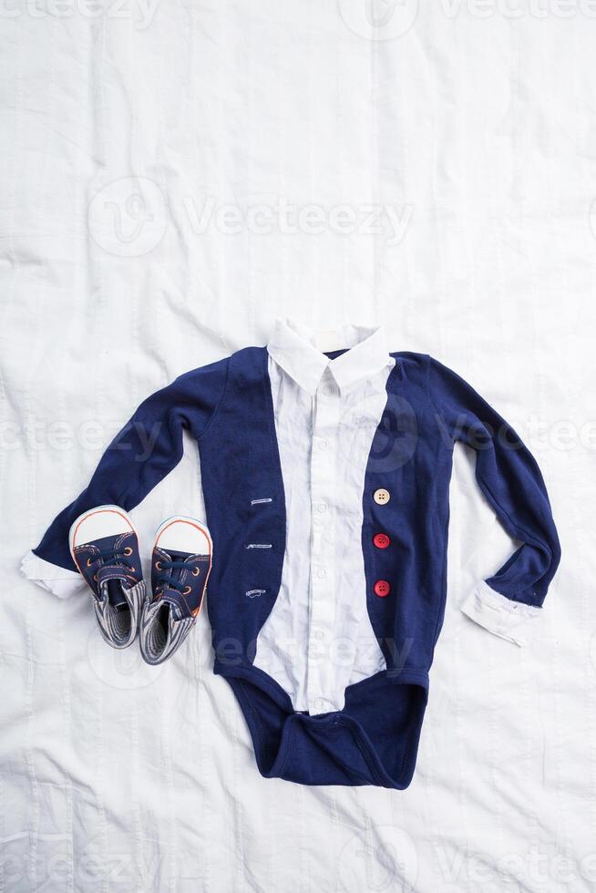 Baby boy clothes on white background photo