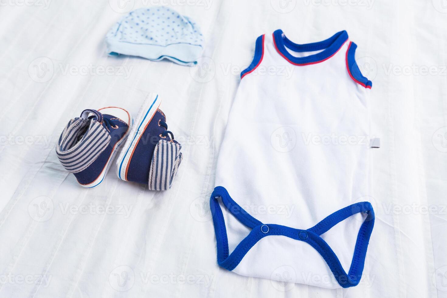 Baby boy clothes on white background photo